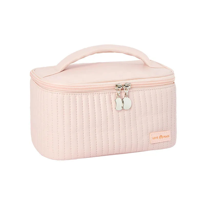 Open-top cake-shaped women's makeup bag in PU leather, shown in a choice of six solid colours.