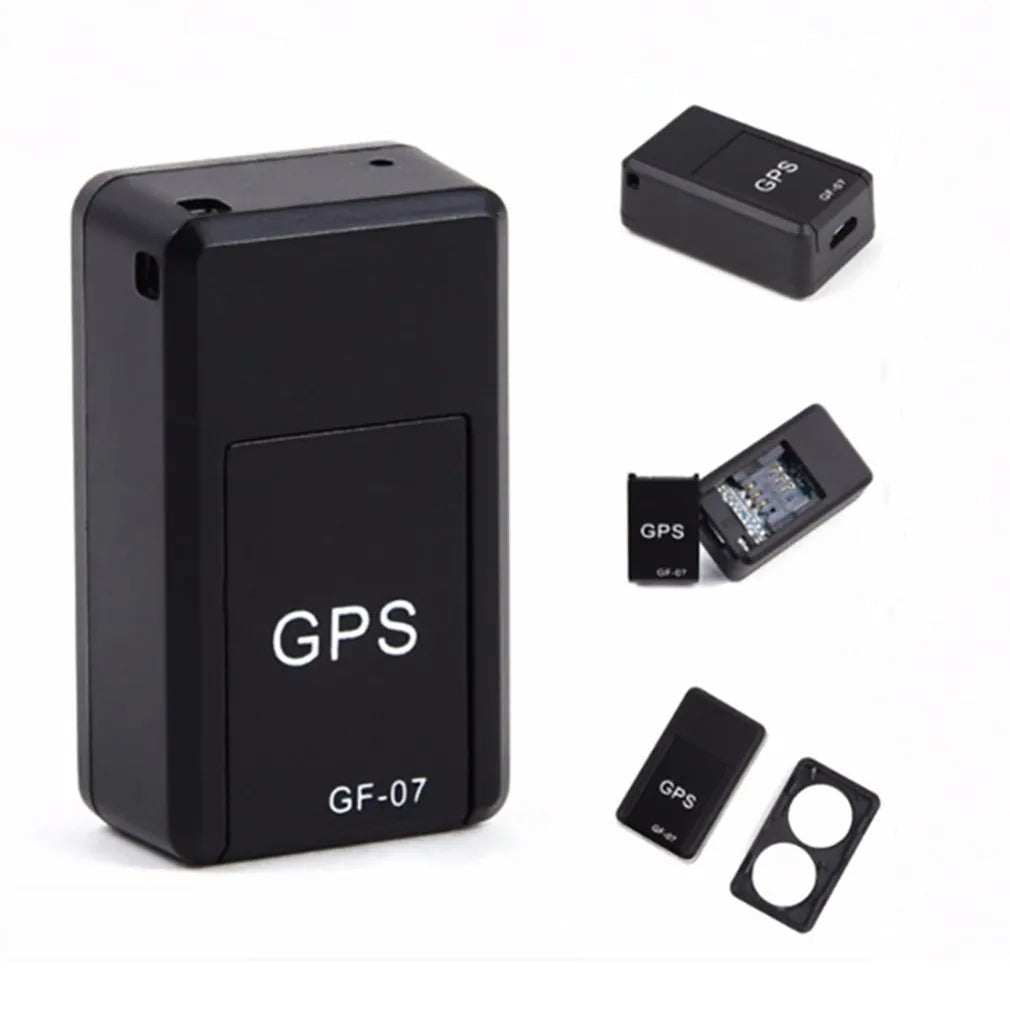 Black plastic magnetic GPS car tracker device measuring 35x20x14mm with USB charging cable