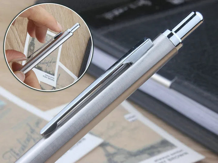 Metal automatic mechanical pencil on a surface, shown with multiple lead size indicators including 0.5mm and 2.0mm.