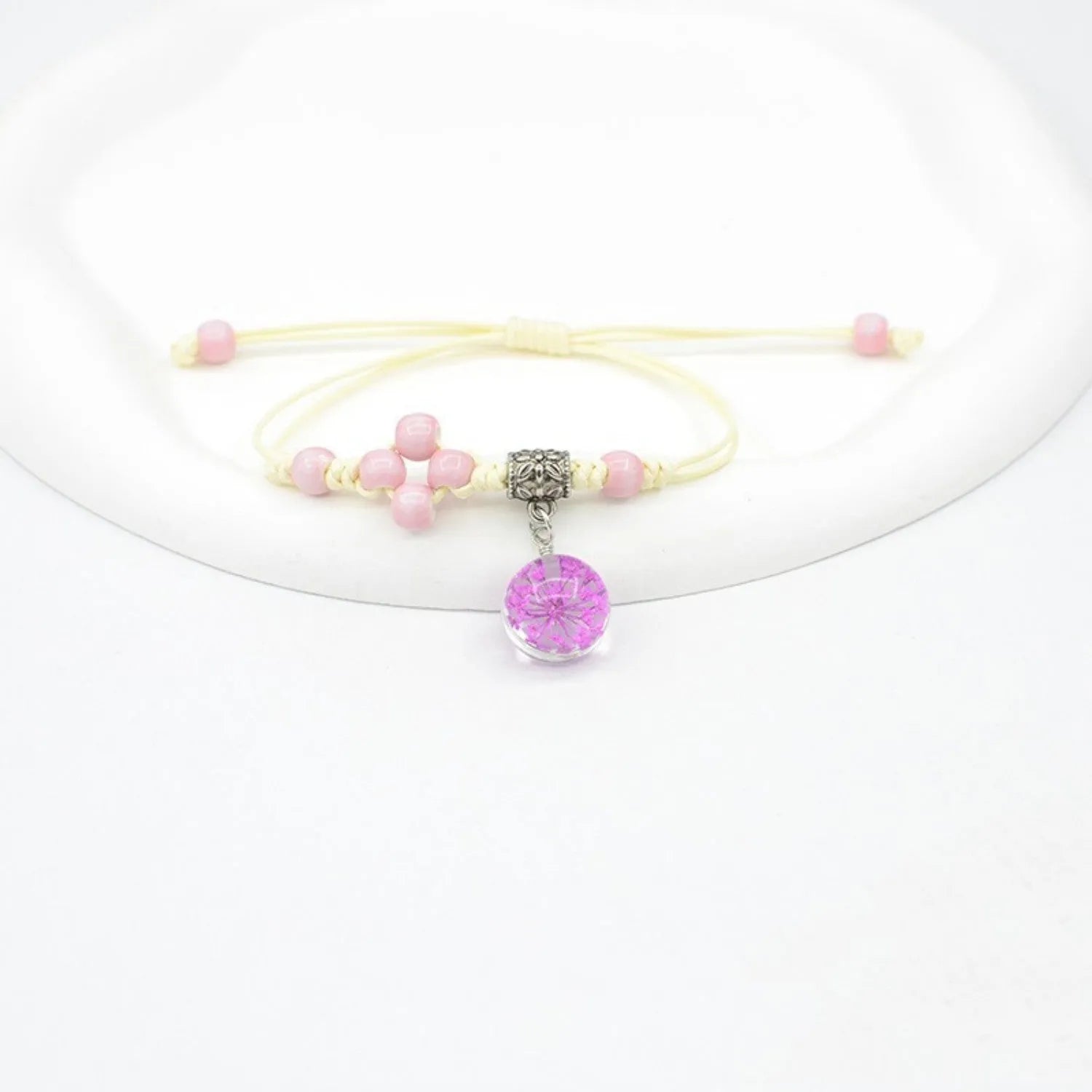 Glass dried flower bracelet with large 1.4cm beads containing real preserved flowers in hand-woven design