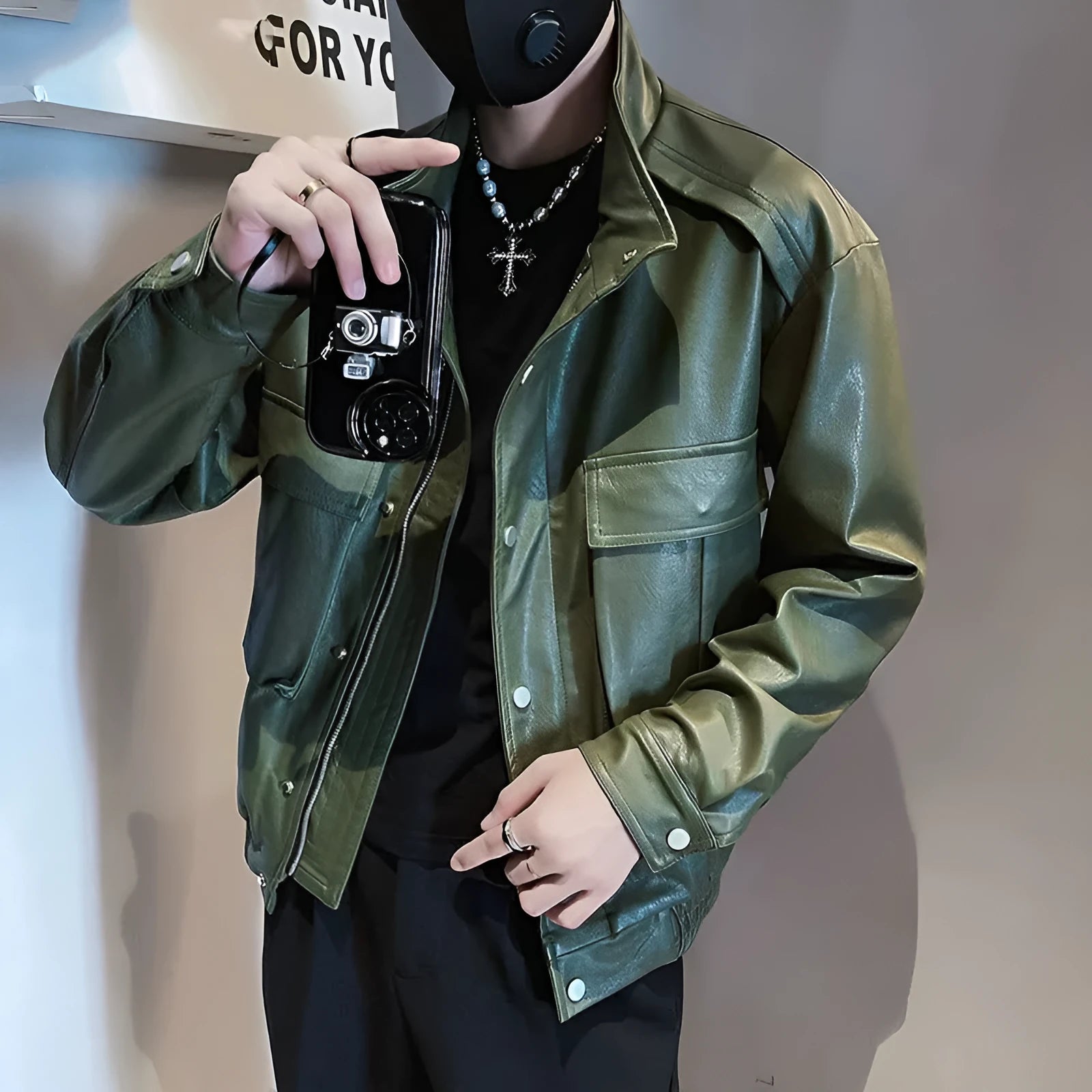 Men's black Korean style pilot leather jacket with side seam pockets on a hanger.