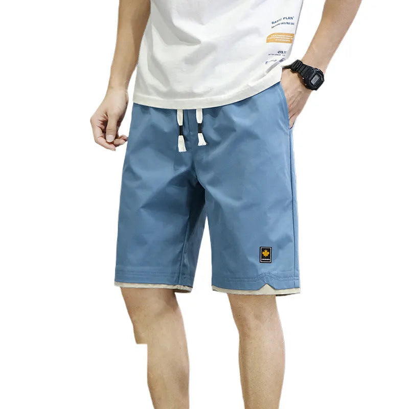 Men's loose-fit straight-leg casual beach shorts in polyester, shown in 8905 Green colour.