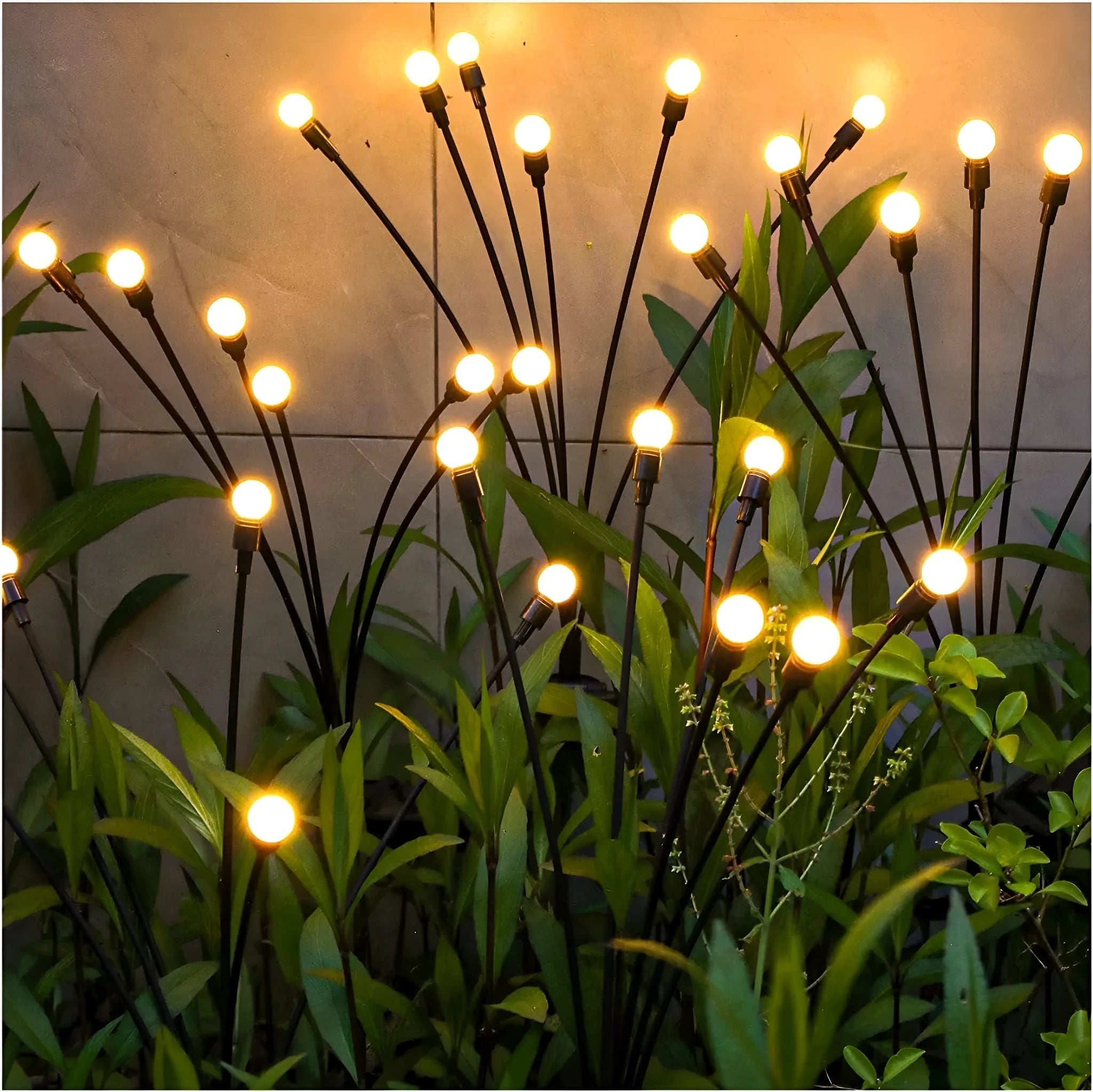 Solar-powered LED ground spike garden light with multiple heads and stainless steel soil plug.