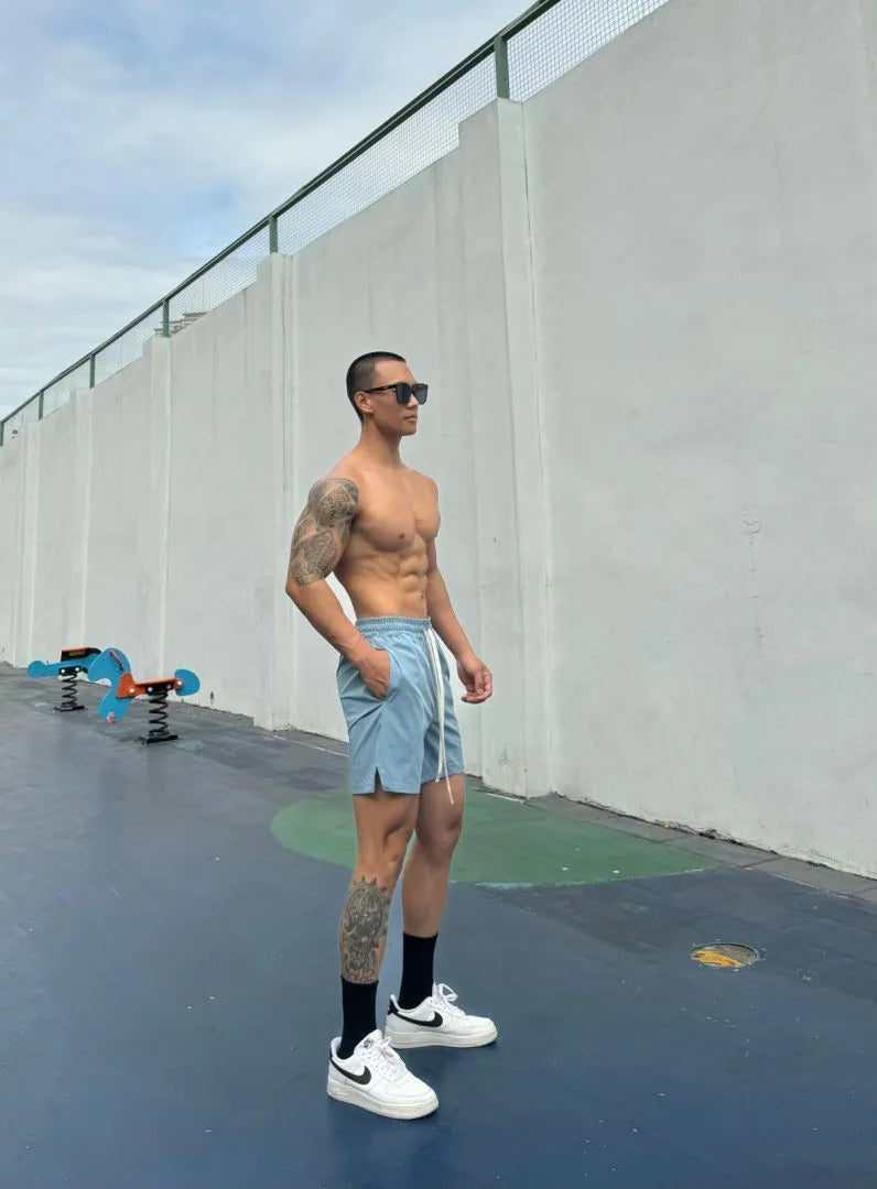 Men's ice silk quick-drying double-layer shorts in six colour options with quarter-length design