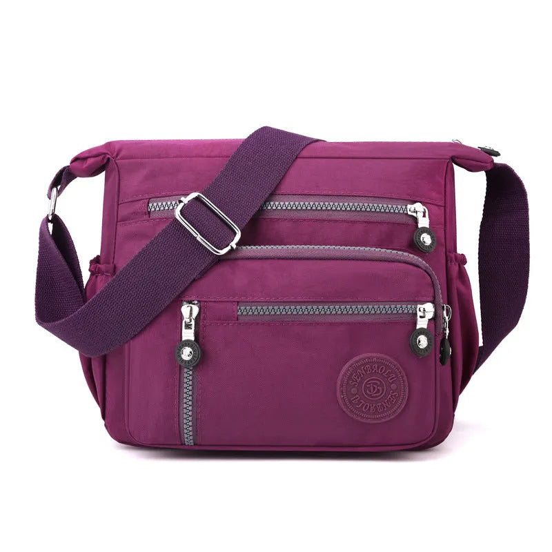 Soft nylon messenger bag with single shoulder strap in square vertical design showing grey colour option