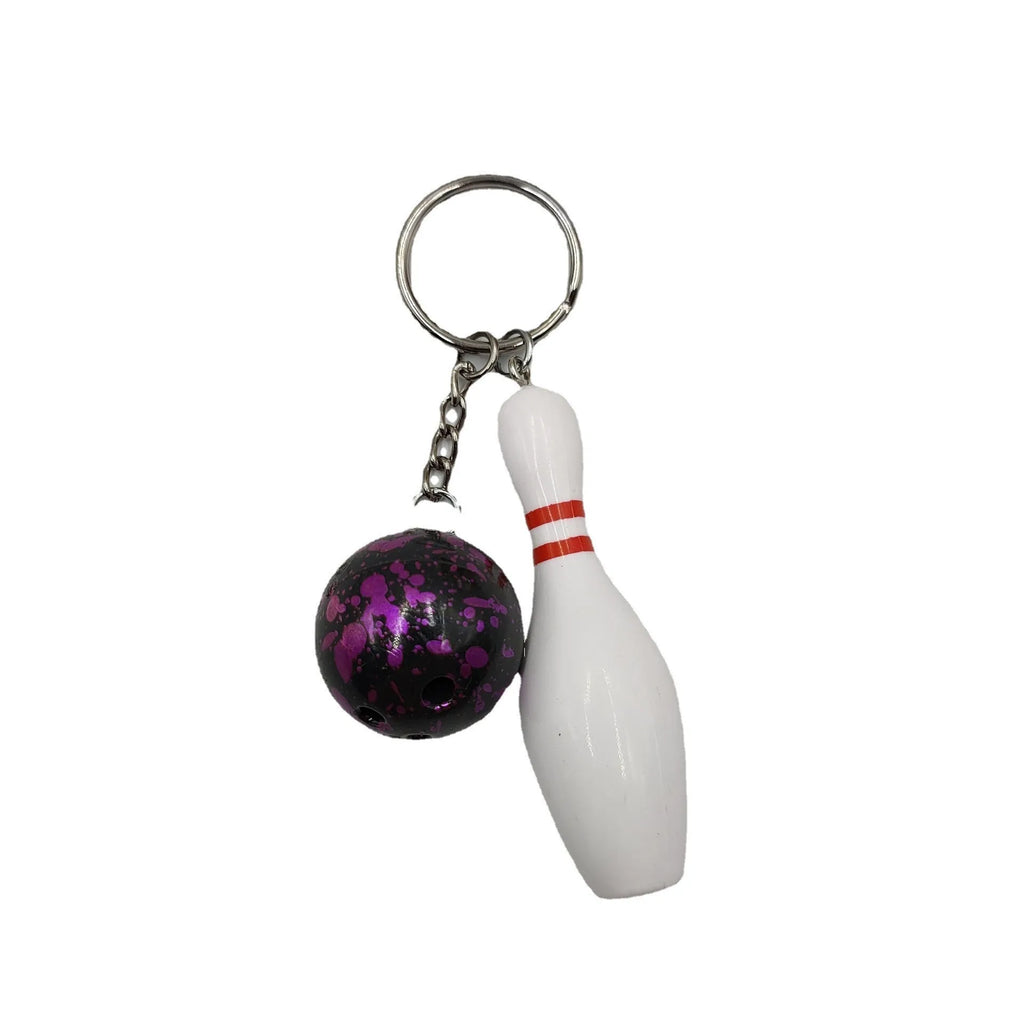 Mini sports bowling keychain pendant in PVC metal, shown in dark red, blue, purple, and green colour options.