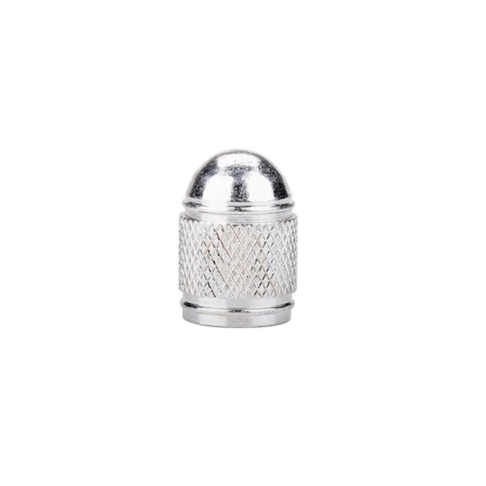 Aluminium alloy mountain bike tyre valve cap in multiple colour choices on a bicycle wheel.