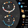 Set of two natural stone beaded bracelets for twelve zodiac signs on a wooden surface.