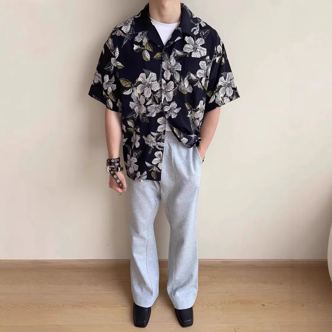 Black floral print vintage Cuban collar ice silk shirt with short sleeves on hanger