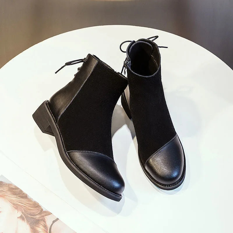 Women's black knee-high Martin boots with side zip, round toe, bow detail, and non-slip rubber sole