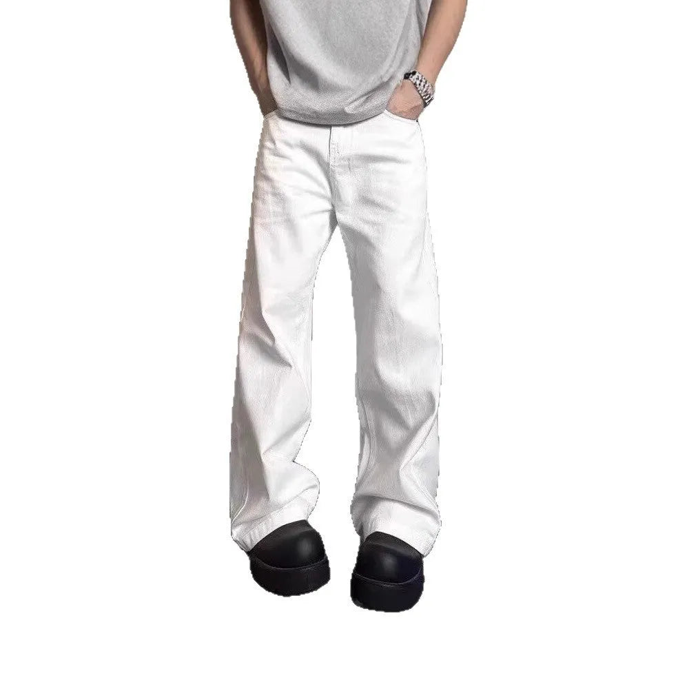 Men's white straight leg wide fit cotton denim jeans on a hanger