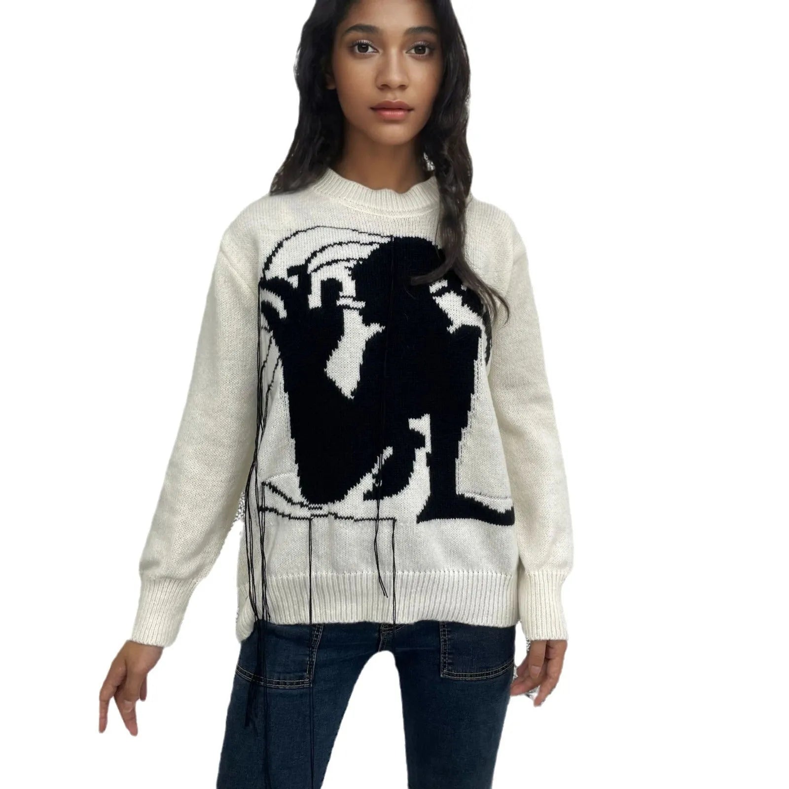 Grey women's alpaca wool pullover sweater with abstract pattern and tassel detailing on a hanger.