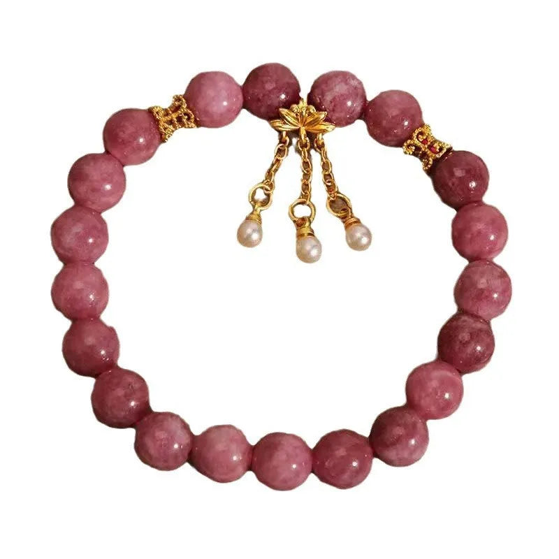 Natural stone bracelet with lotus tassel pendant and pearl details in pink lotus colour