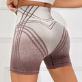 Women's high waisted gradient fitness shorts in black and brown for yoga and running