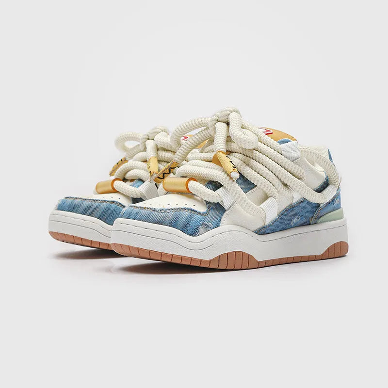 Low-top unisex casual shoes in denim blue with white rubber sole and lace-up front.