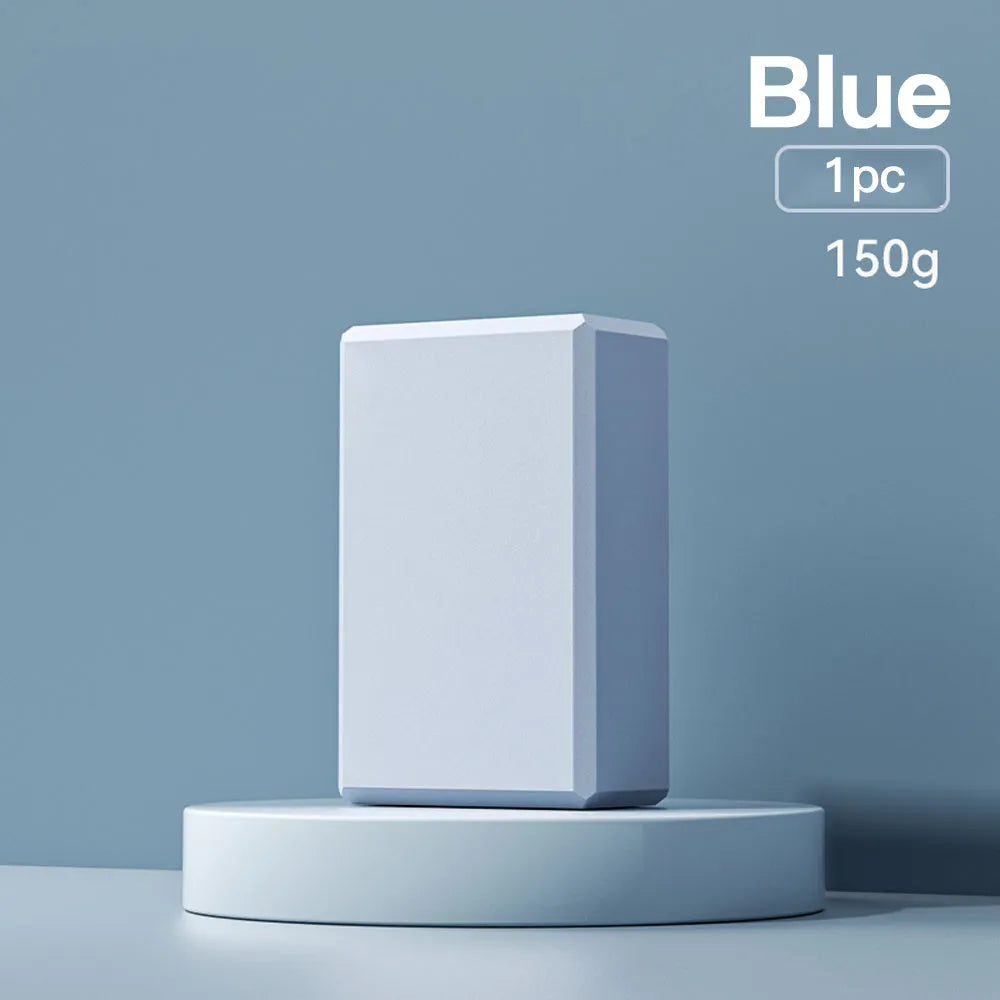 Solid colour EVA foam yoga block measuring 23x15x7.6cm with textured ridges for grip