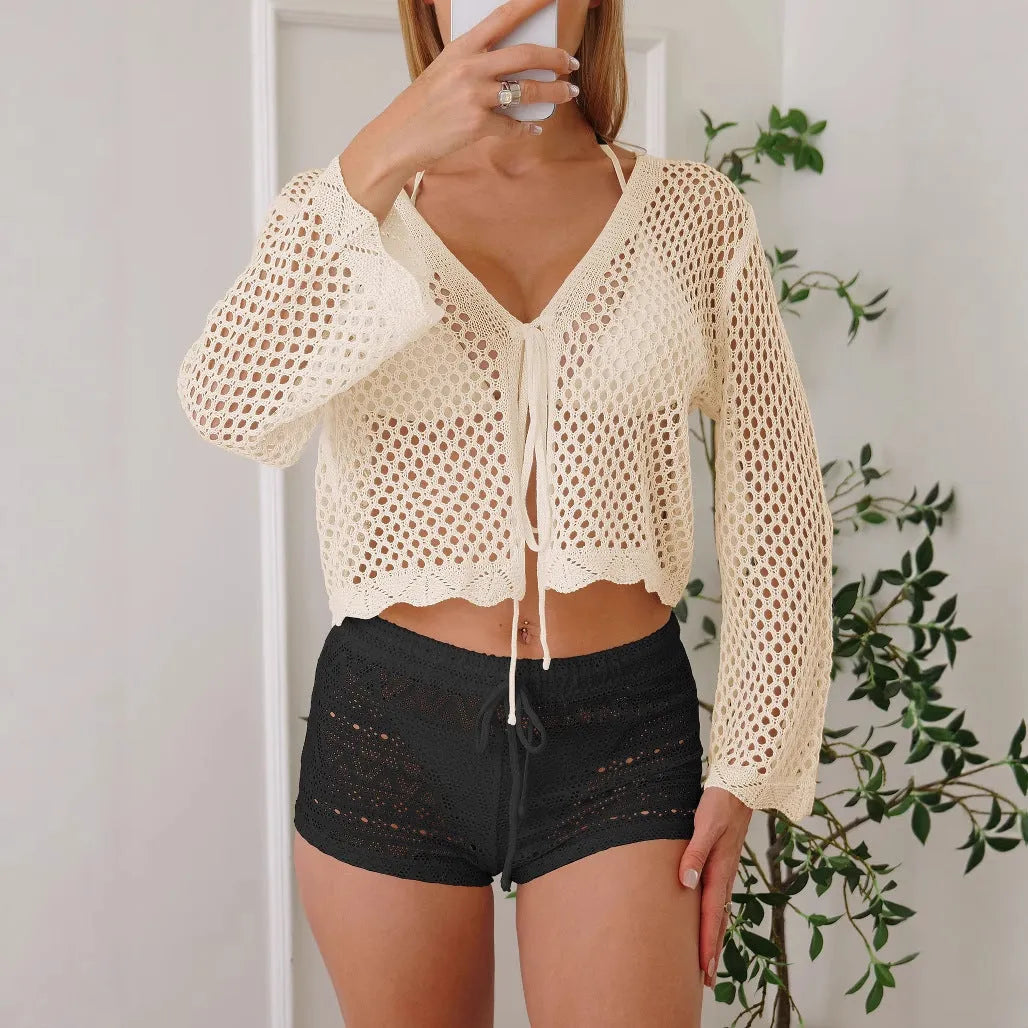 Short length women's cardigan blouse with bell sleeves in a choice of colours.