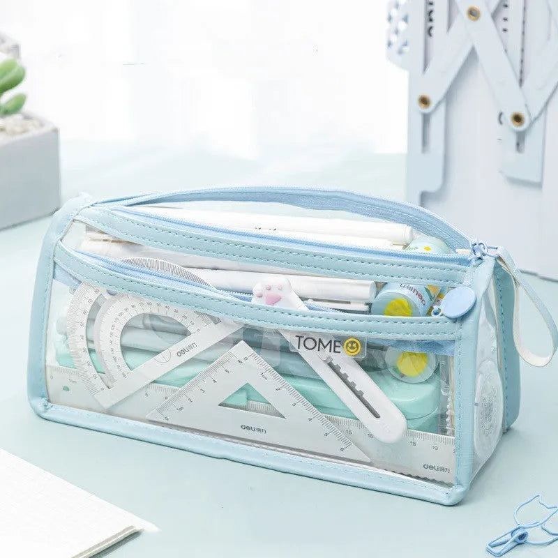 Transparent double-layer pencil case showing two compartments with writing instruments inside, dimensions 220x110x80mm