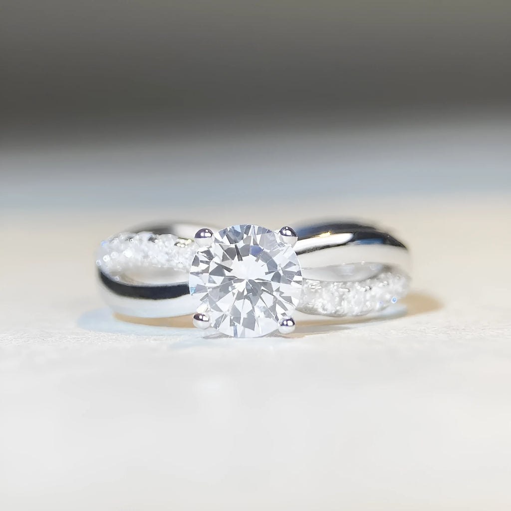 Silver geometric cross ring with 1 karat moissanite stone and twisted band