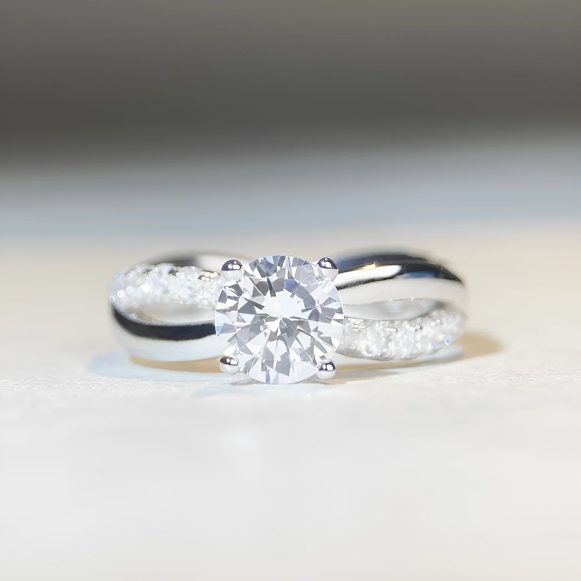 Silver geometric cross ring with 1 karat moissanite stone and twisted band