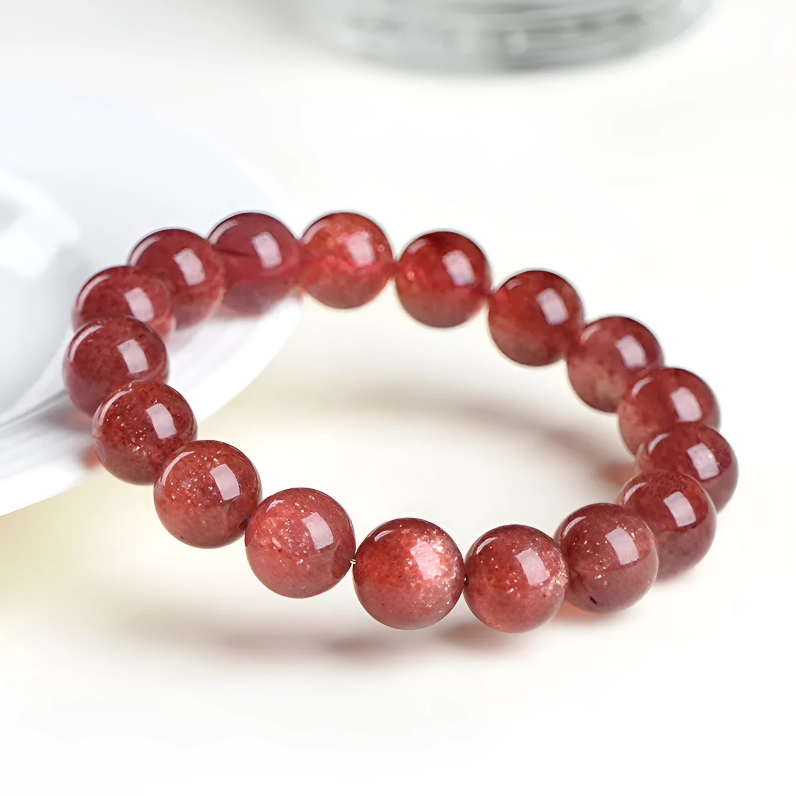 Natural strawberry quartz bracelet with geometric red crystal beads in three size options from 7mm to 10.8mm diameter