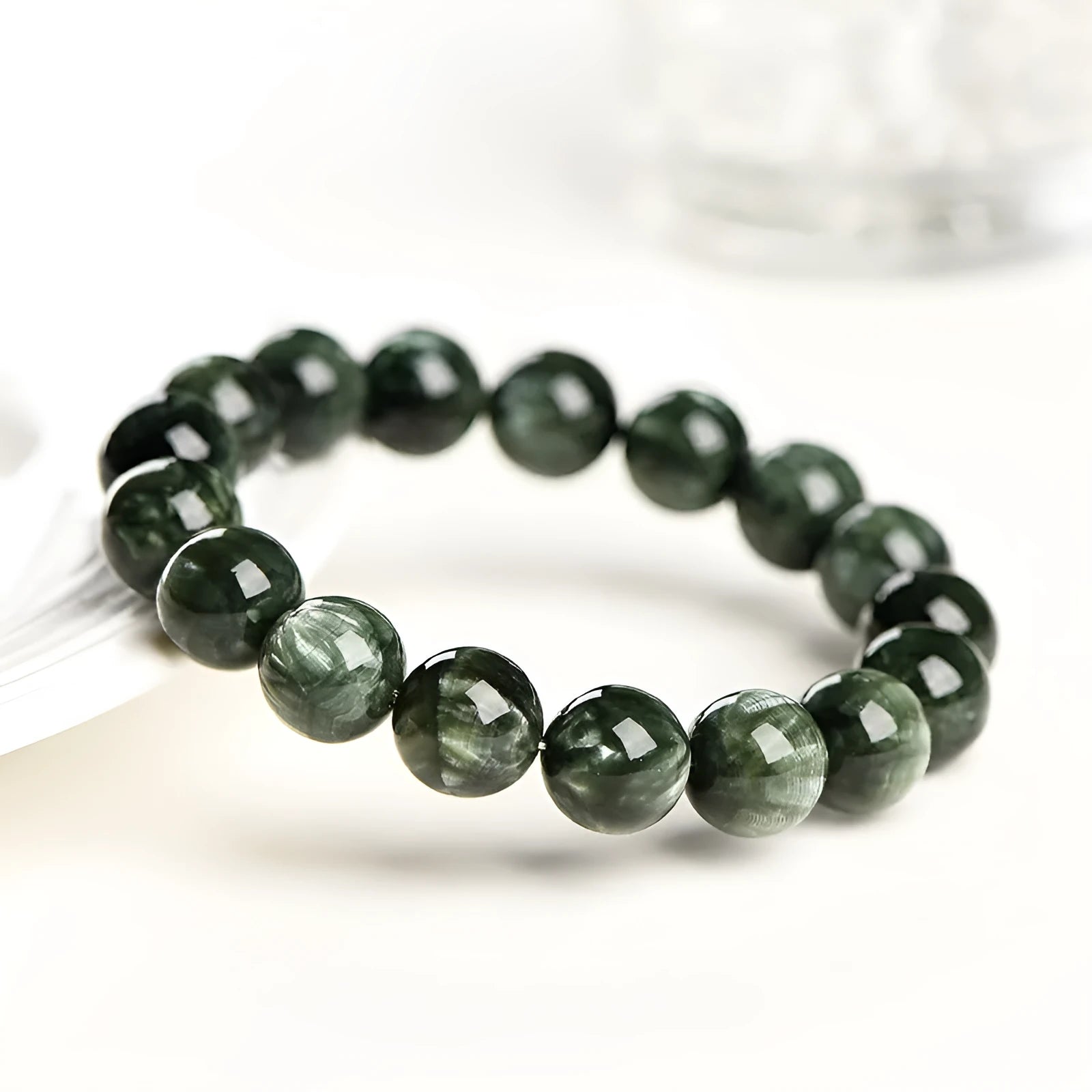 Green Dragon Crystal bracelet with 8-9mm round beads featuring Ruyi geometric design