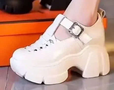 Women's black and white skull pattern pumps with a chunky wedge heel and satin upper.