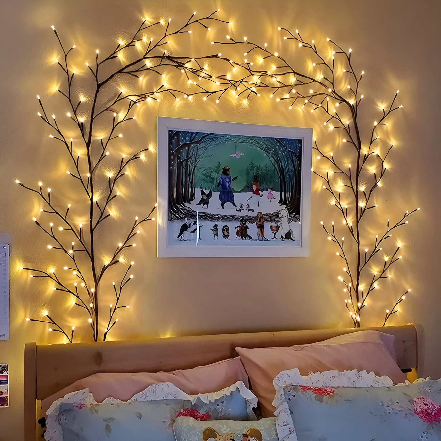 Flexible birch bark textured LED willow vine garland bent into shape with warm white lights.