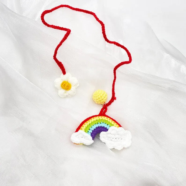 Handmade crocheted avocado car pendant with rainbow flower design in wool material