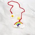 Handmade crocheted avocado car pendant with rainbow flower design in wool material