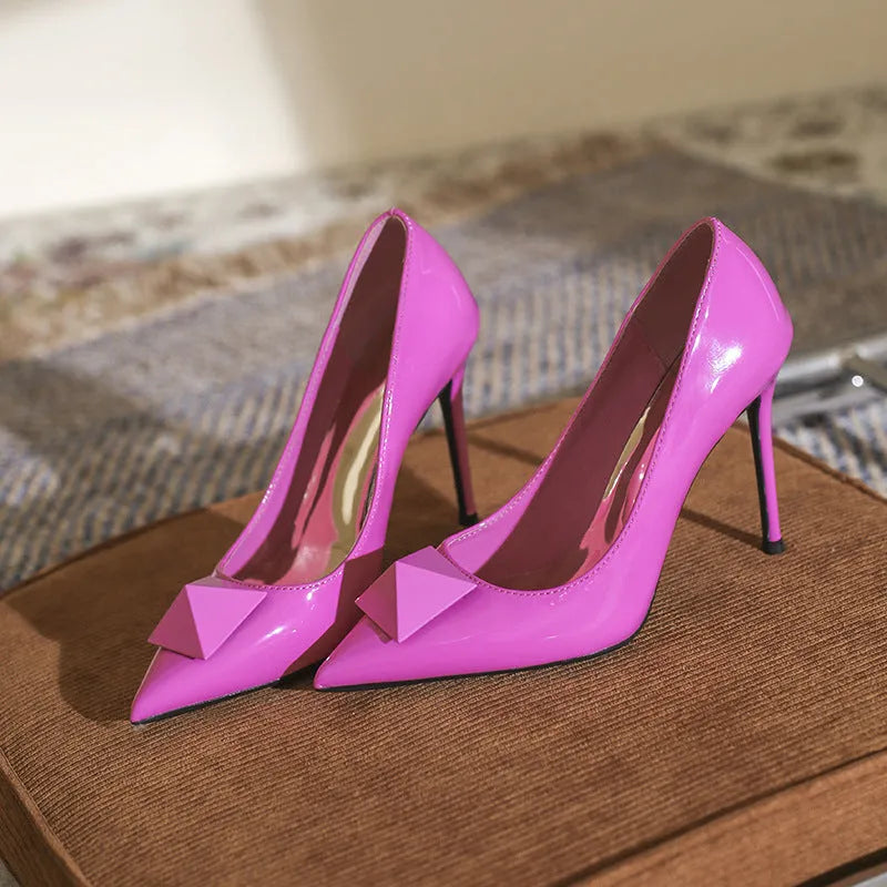 Pink patent leather women's pointed toe stiletto heels with buckle detailing