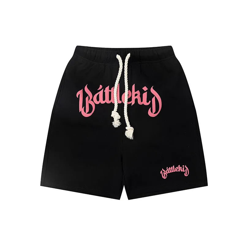 A pair of loose-fit black hip hop shorts made from cotton blend fabric on a mannequin.