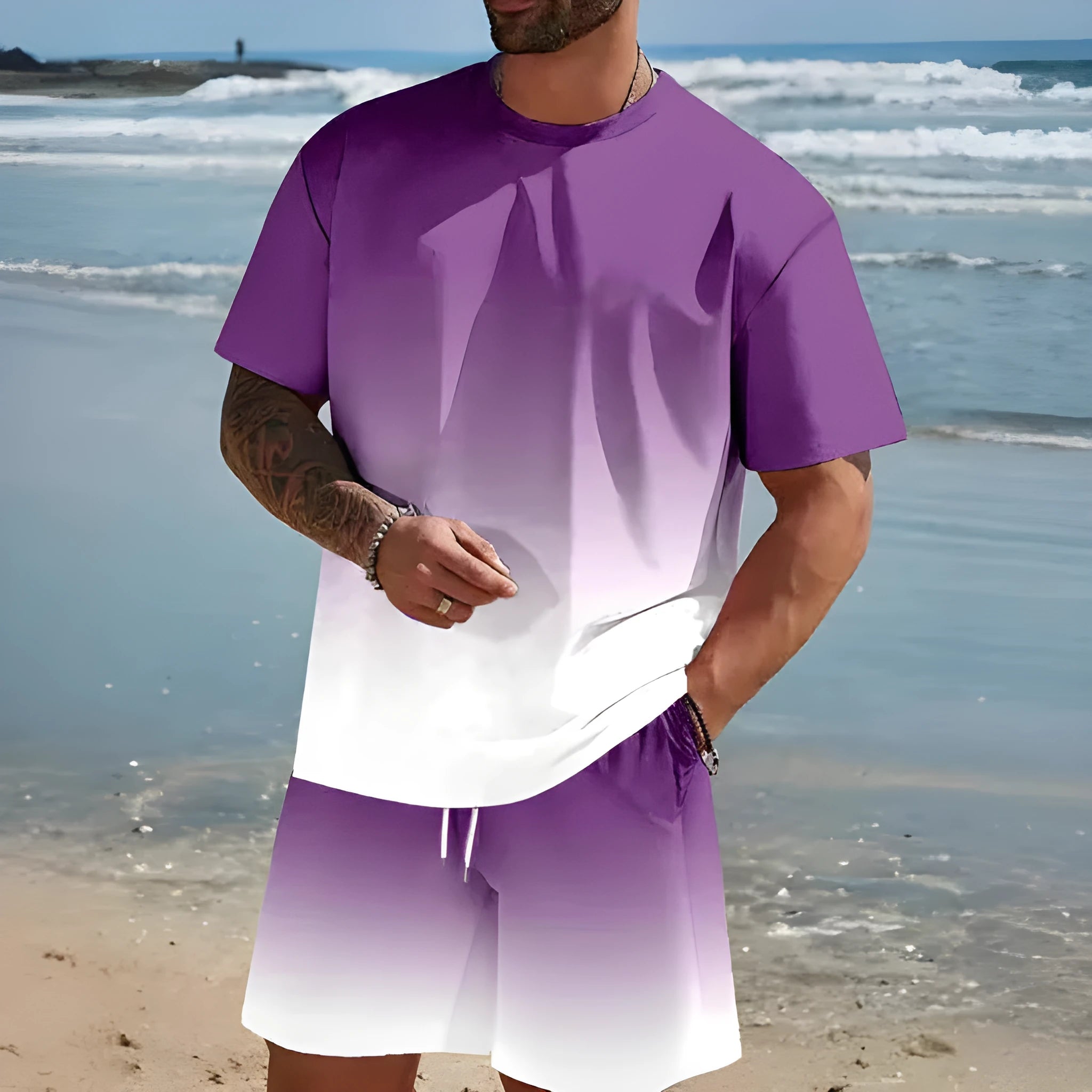 Man wearing a loose light blue short-sleeved T-shirt and matching shorts from a summer leisure suit set.