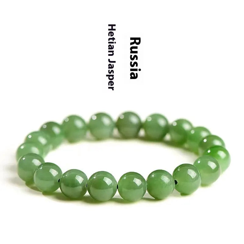 Polished natural Jasper Hetian jade bead bracelet on wrist, showing bead detail.