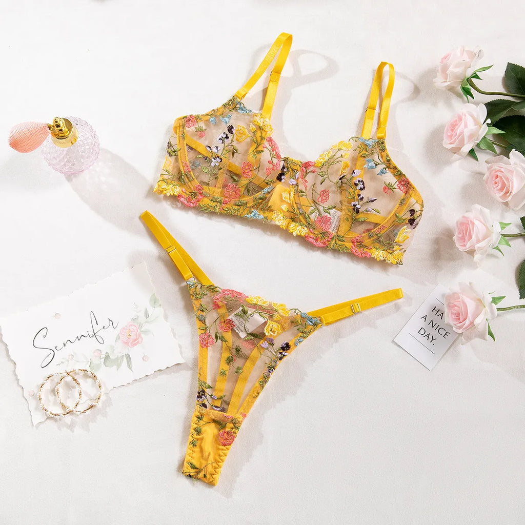 Women's floral underwear set in pure desire style showing five colour options including skin tone, purple, black, yellow and pink
