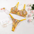 Women's floral underwear set in pure desire style showing five colour options including skin tone, purple, black, yellow and pink