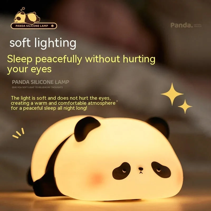 White panda-shaped night light with black accents measuring 150mm tall with USB charging port