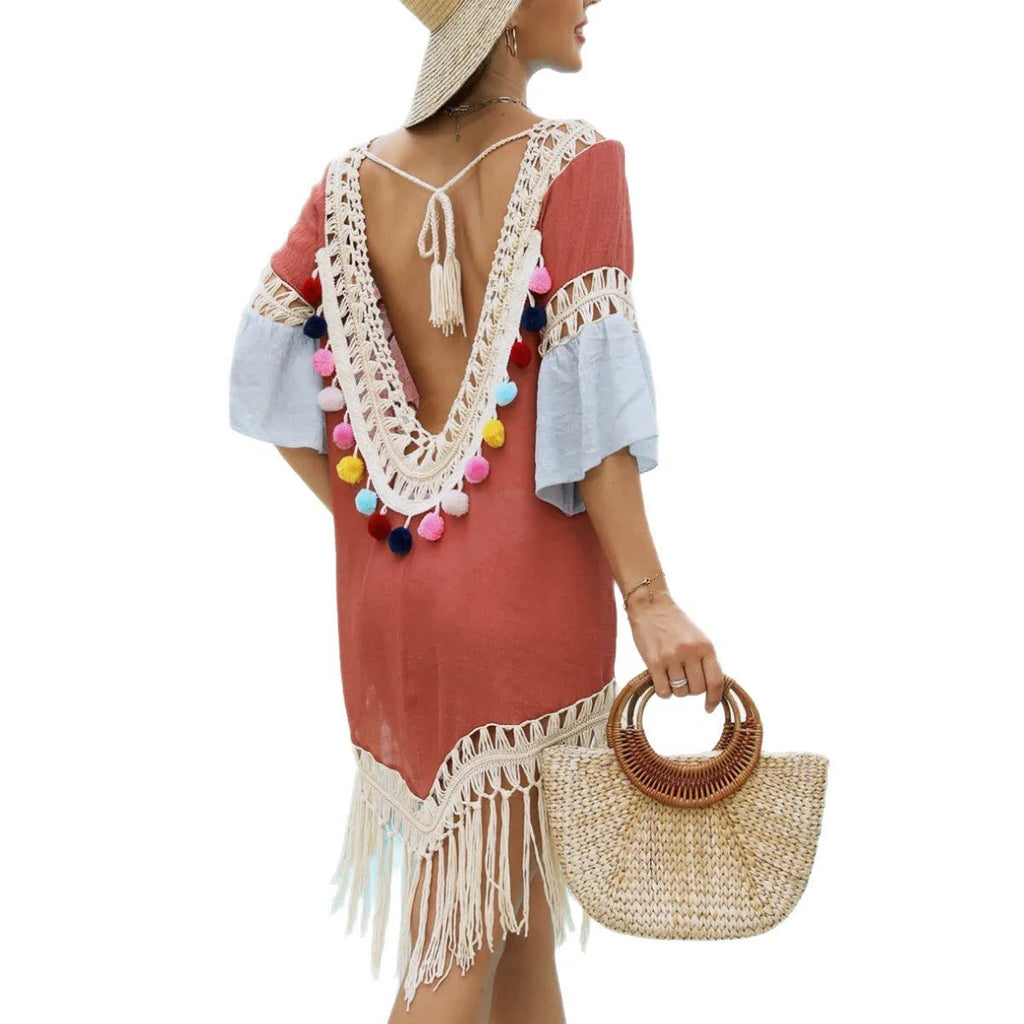 Orange hand crochet beach overskirt with floral pattern and tassel trim