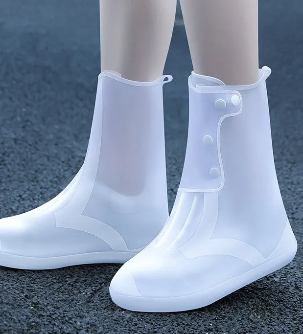 White PVC high top reusable shoe covers for women, shown on a foot, for water resistant protection.