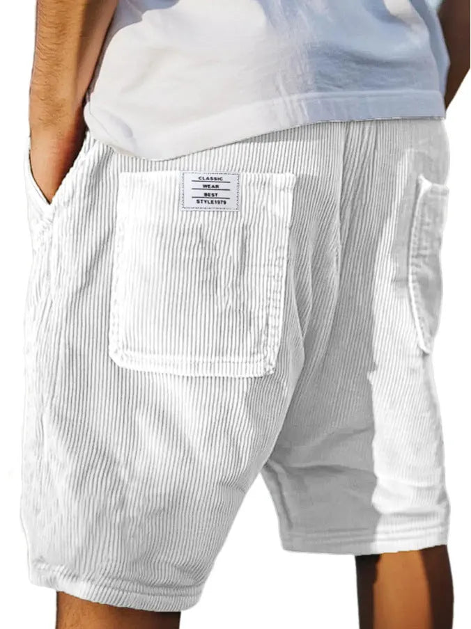 Men's grey corduroy shorts with embroidered detail on multiple pockets, laid flat.