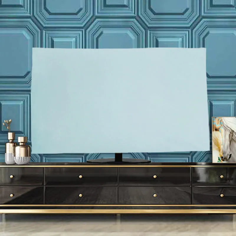 A pink velvet television cover draped over a flat-screen TV, showing its elasticated hem and soft fabric texture.