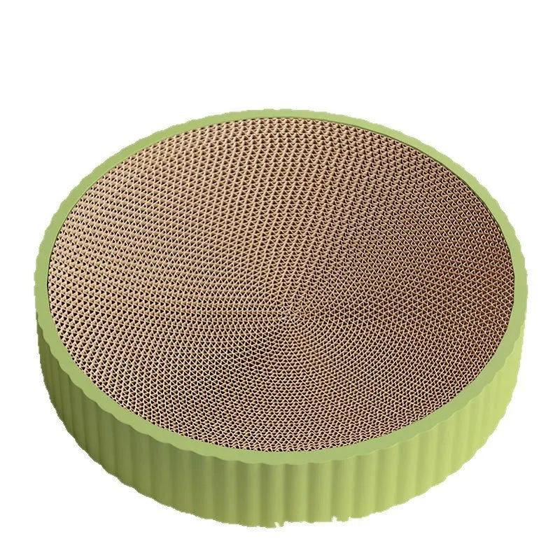 Green and white round cat scratching board with corrugated paper centre measuring 55 cm diameter