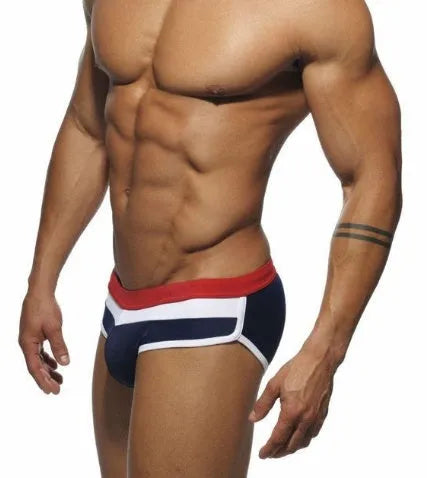 Men's nylon patchwork swim trunks in black, dark blue, and pink, available in sizes M to XXL