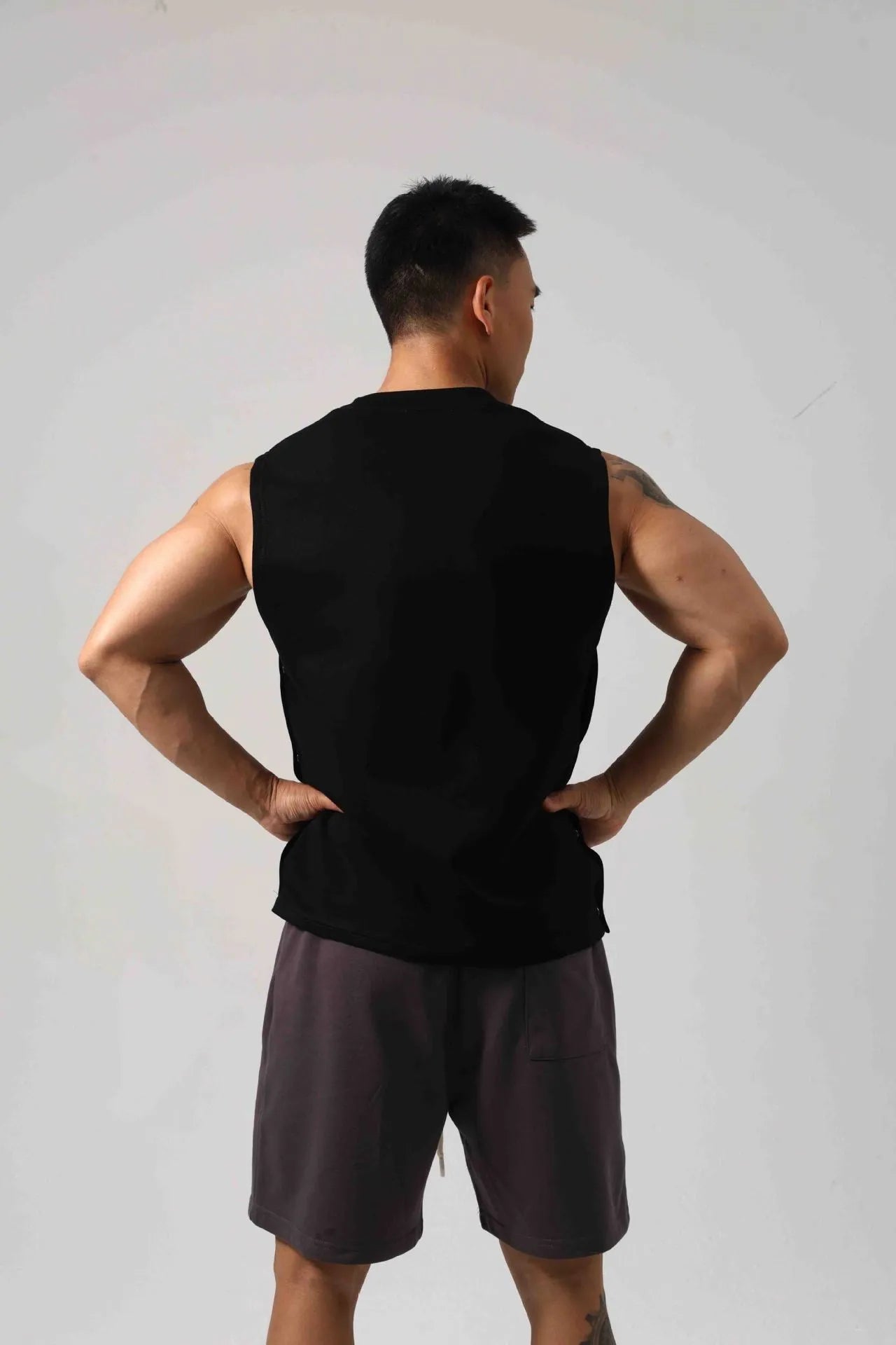 Korean style loose cotton fitness vest for men with hidden hook side openings.