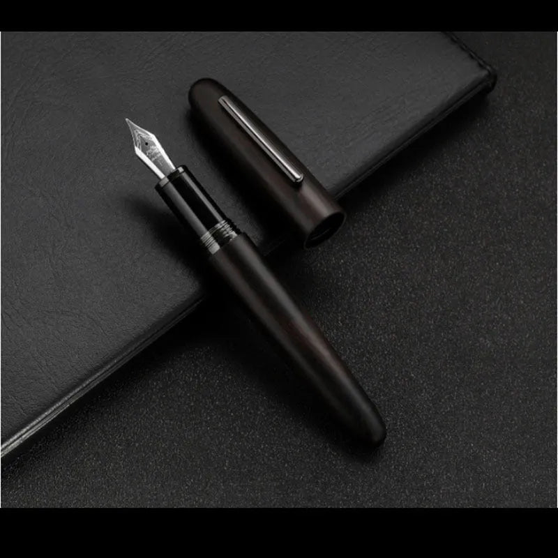 Wooden fountain pen with rotating cap in various wood finishes with interchangeable nib options