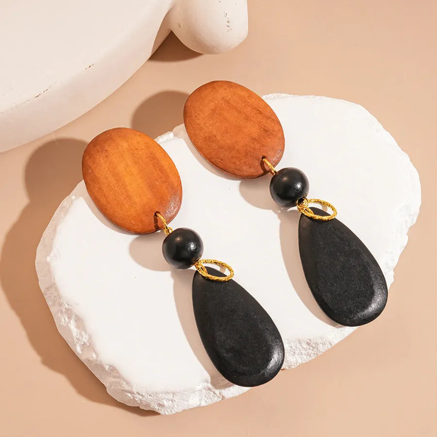 Wooden retro fashion earrings with elliptical shape and silver-brown-black colour combination
