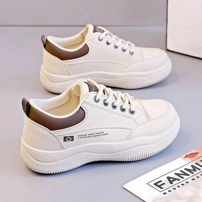 Women's white Korean-style leather pumps with cross straps and a flat mid-height heel.