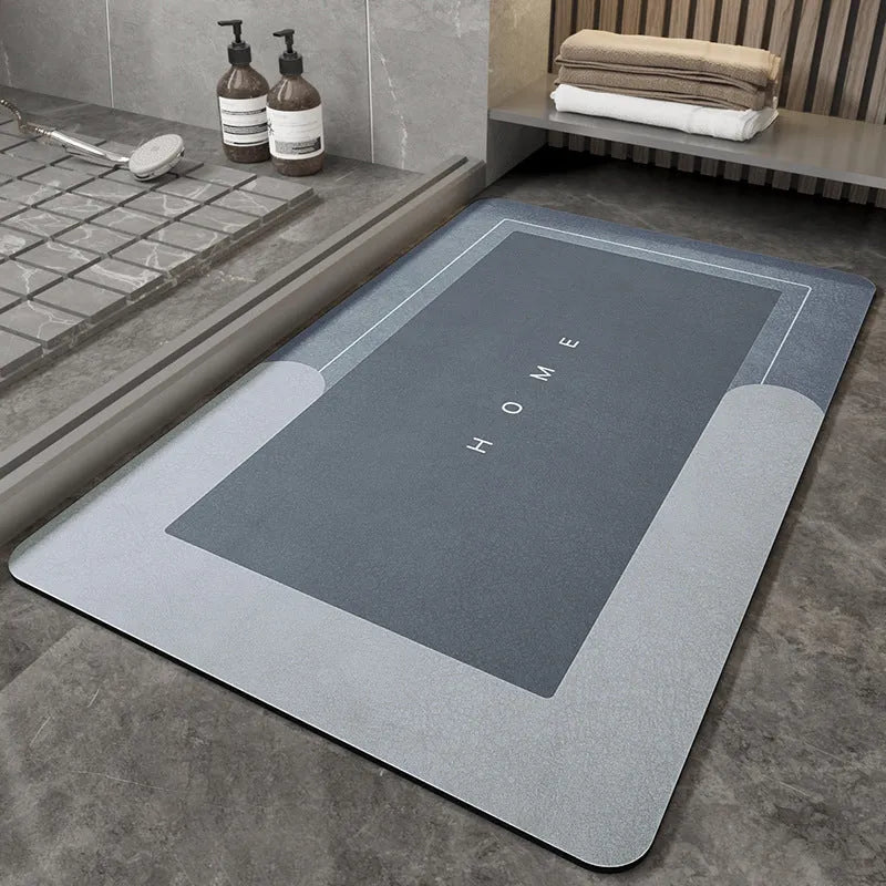 Blue oval blended fabric bathroom floor mat on a tiled floor