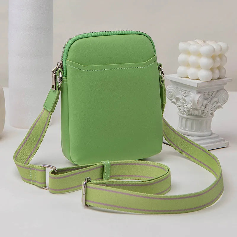 Small solid colour mobile phone crossbody bag in PU leather measuring 14.5cm wide
