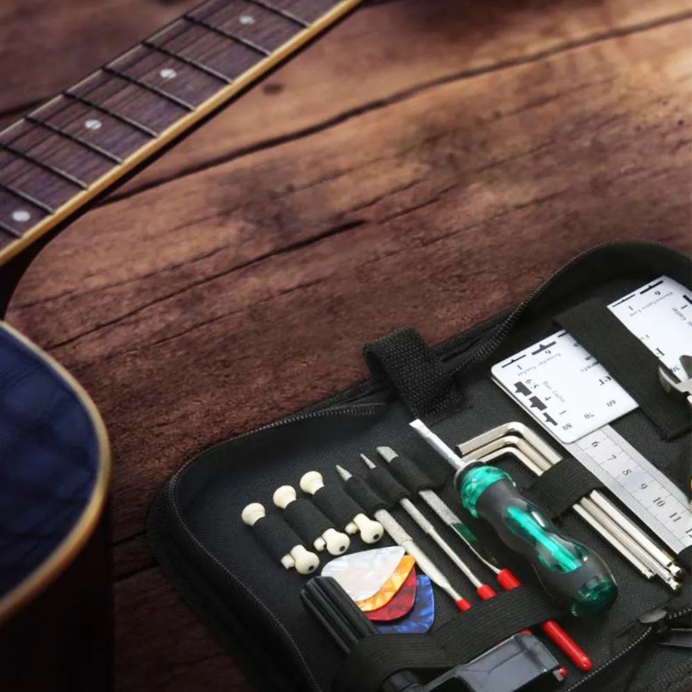 Black plastic case open to show guitar repair and maintenance tools inside.